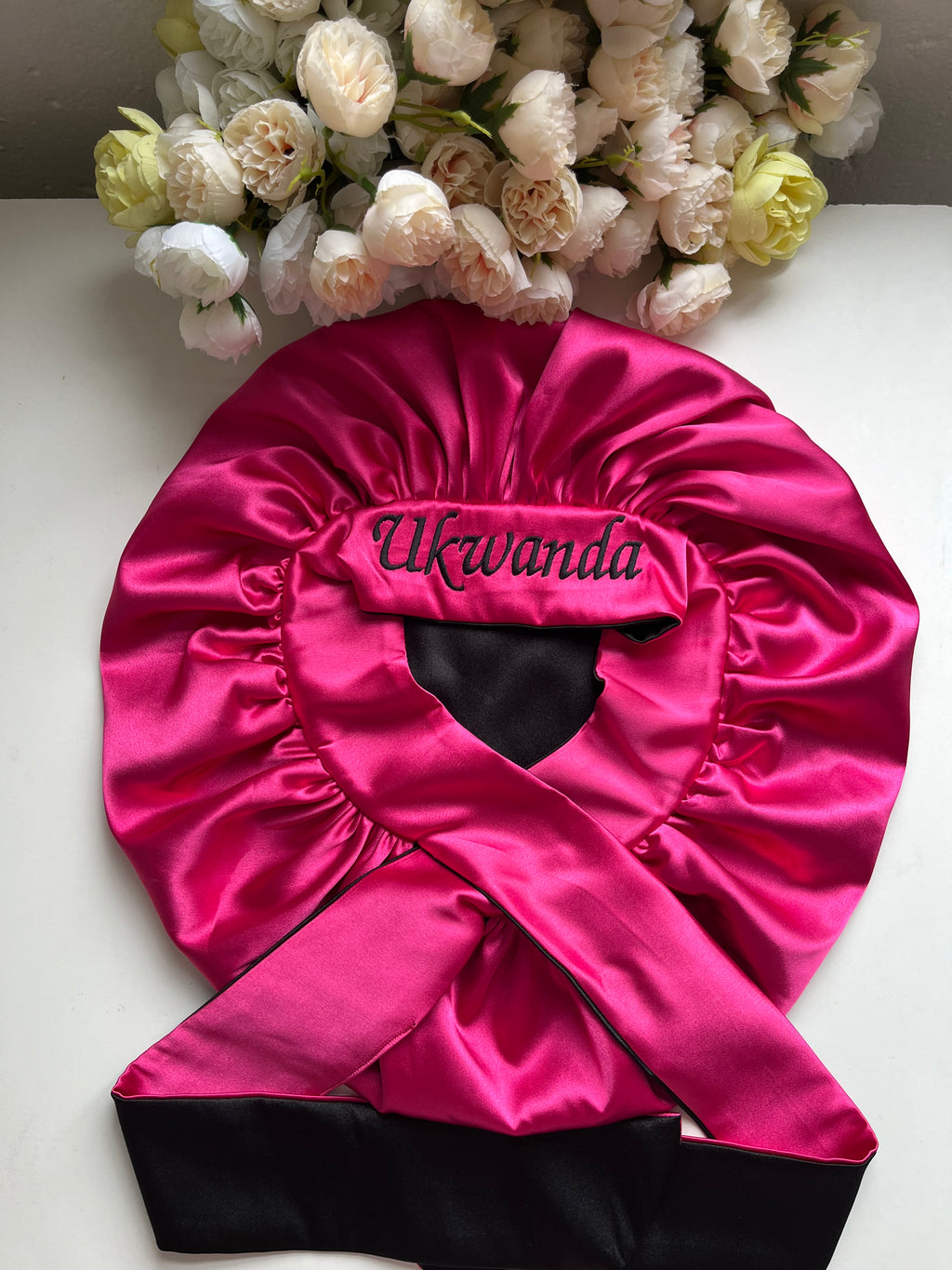 Pink and black hair bonnet
